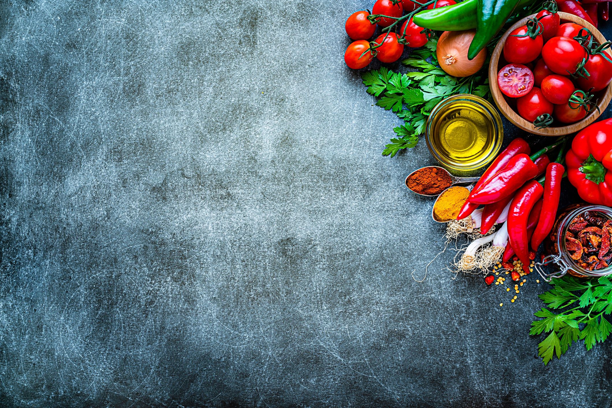 Cooking backgrounds: tomatoes and peppers with copy space